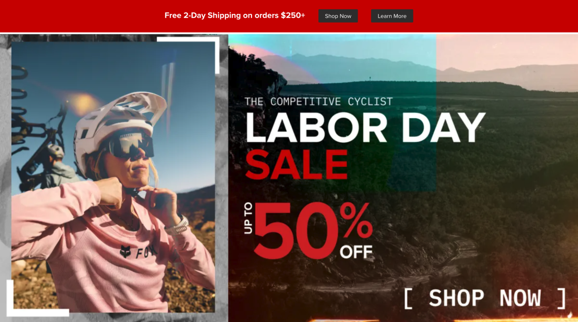 A woman wearing a cycling helmet and sunglasses adjusts her gear in an outdoor mountainous setting. The image features promotional text for a Labor Day sale, offering up to 50% off on cycling products. The background showcases trees and hills under a clear sky.