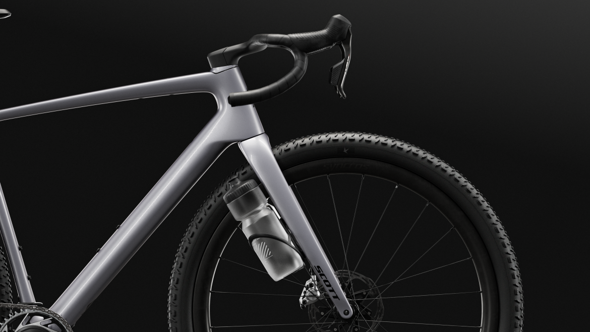 A close-up view of a sleek, modern bicycle frame featuring a lightweight design, with a prominent front fork and handlebars. A water bottle is mounted on the frame, and the background is a smooth gradient of dark colors, emphasizing the bike's metallic finish and details.