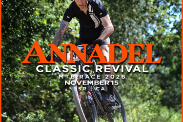A mountain biker performing a jump on a trail surrounded by greenery, with text overlay that reads "ANNADALE CLASSIC REVIVAL MTB RACE 2026 NOVEMBER 15 SR CA." The image emphasizes the excitement of the race event.